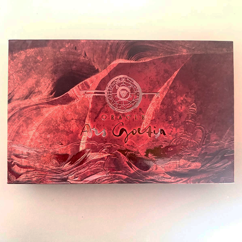 Red marbled product packaging with 'Oracle' branding on a light background