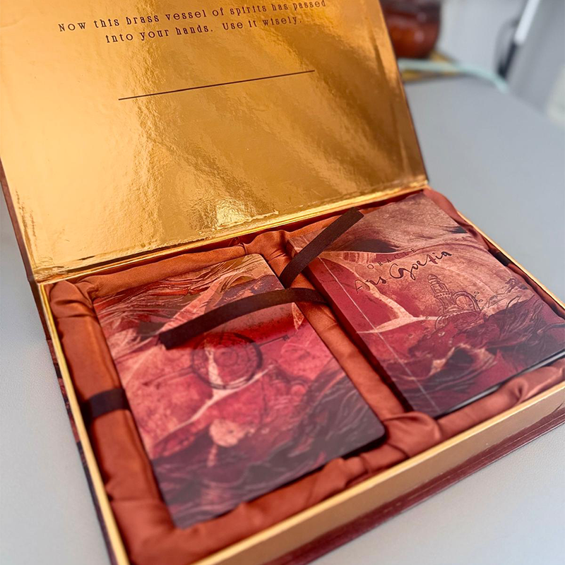 Photo of  Decorative box with maroon fabric and gold interior
